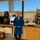 Jackie poses in lab after being given the Outstanding Graduate Student award
